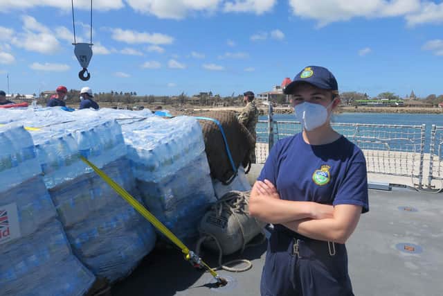 Sub-Lieutenant Winter, aged 23 from Gosport, is pictured as disaster relief stores are unloaded in Tonga from HMS Spey