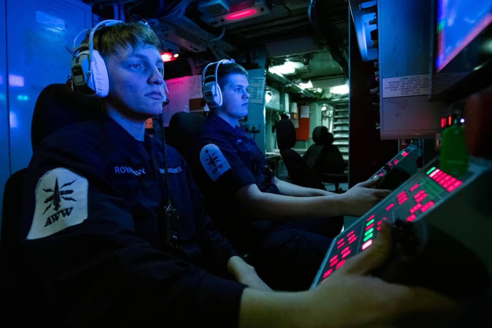 Pictured: Ships 'Gunners' (left to right) Darach Winstanley-Jones and James Hearn monitor a screen during an air defence exercise on HMS Lancaster.

Credit: LPhot Dan Rosenbaum, HMS Lancaster