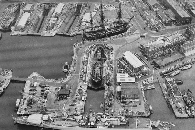 The Royal Navy County-class destroyer HMS Norfolk is seen from the air lying up in the Portsmouth dockyard near the18th century 104-gun first-rate ship of the line and Admiral Lord Nelson's flagship HMS Victory on 15 October 1970 in Portsmouth, United Kingdom.  (Photo by Central Press/Hulton Archive/Getty Images).