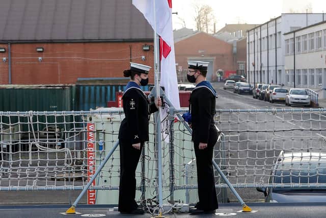 Pictured: The ensign is raised for the first time on board HMS Spey by ceremonial staff, during the ceremony.