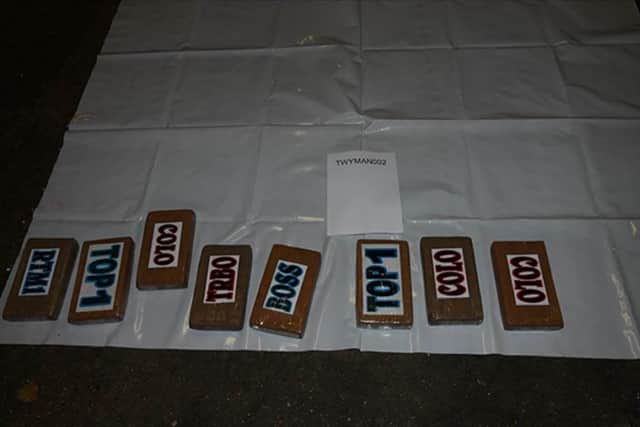 45 kilos of cocaine in brown taped packages found  behind wooden boards in Rafal Czajka's lorry. Picture: PA Wire