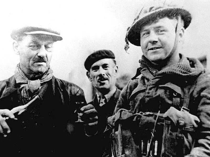 A Normandy farmer offers a glass of Calvados to a British paratrooper from the 6th Division's Hampshire Regiment in this file photo taken June 6 1944. The British were dropped between the villages of Ornes and Dives in the first hours of Operation Overlord. AFP PHOTO (Photo credit should read B/AFP/Getty Images)
