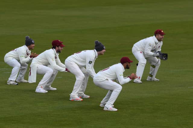 The woolly hat brigade - Ricardo Vasconcelos, Alex Wakeley, Tom Taylor, Emilio Gay and wicketkeeper Adam Rossington crouch during the opening day of Northants' friendly against Hampshire at The Ageas Bowl. Photo by Mike Hewitt/Getty Images.