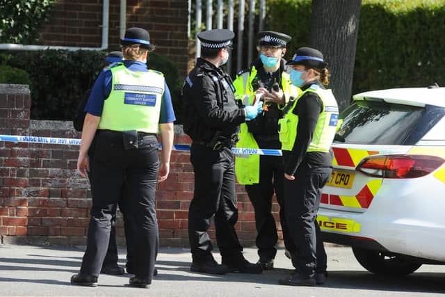 Detectives have launched an investigation after a man's body was found outside Cosham Library on Friday morning, July, 3.
Pictured is: Officers in PPE guarding the scene on Friday morning.
Picture: Sarah Standing (030720-5324)