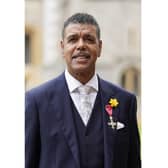 Chris Kamara wears his Member of the Order of the British Empire (MBE) medal, presented to him by the Prince of Wales, for services to association football, anti-racism and to charity, following an investiture ceremony at Windsor Castle in Berkshire. Picture date: Tuesday March 7, 2023.