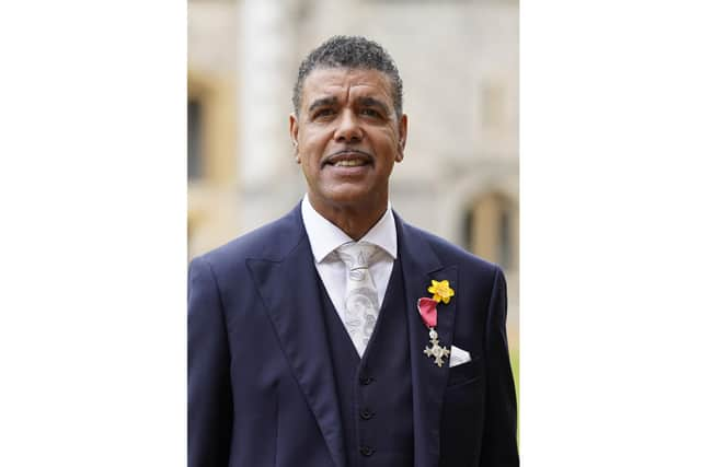 Chris Kamara wears his Member of the Order of the British Empire (MBE) medal, presented to him by the Prince of Wales, for services to association football, anti-racism and to charity, following an investiture ceremony at Windsor Castle in Berkshire. Picture date: Tuesday March 7, 2023.