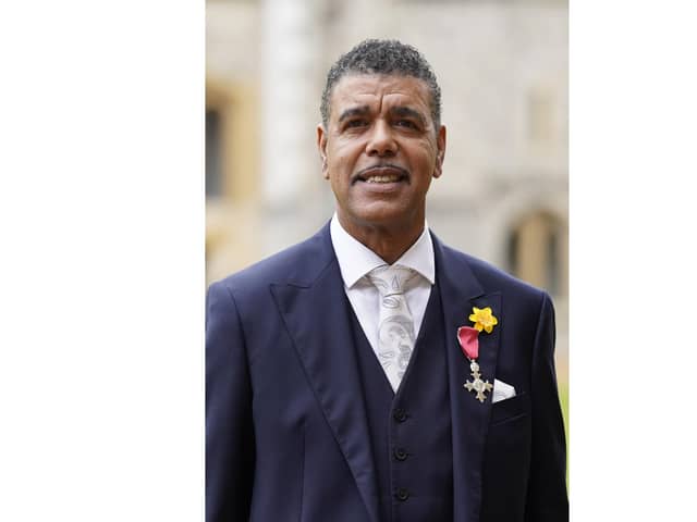 Chris Kamara wears his Member of the Order of the British Empire (MBE) medal, presented to him by the Prince of Wales, for services to association football, anti-racism and to charity, following an investiture ceremony at Windsor Castle in Berkshire. Picture date: Tuesday March 7, 2023.