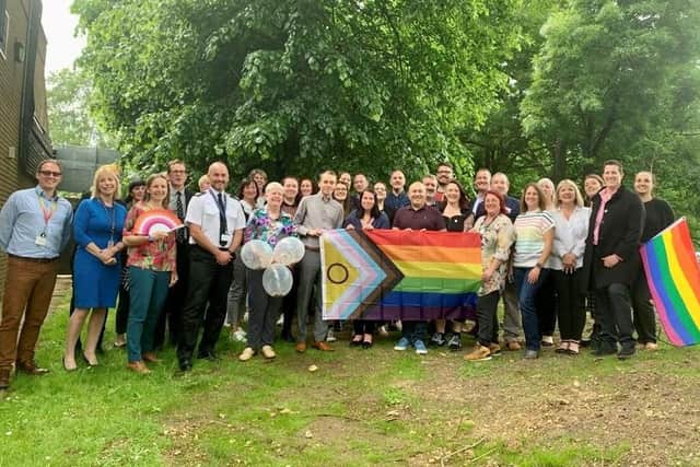 Members of the LGBT+ Link Officer team at the 25th anniversary event at Eastleigh with ACC Paul Bartolomeo (pictured in uniform). Kirsten Troman is holding the fan.
