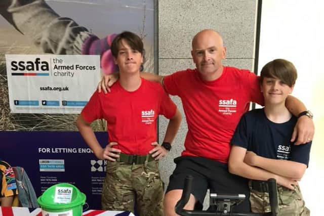 Rob Lofthouse during a charity bike ride for SSAFA with his two sons Archie, left, and Jamie.