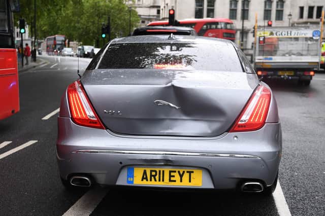 A large dent in the car of Britain's Prime Minister Boris Johnson is seen after an incident where a protester runs into the road toward the convoy and the lead car stopped and was struck by the next car in the convoy leaving the Houses of Parliament in London. Picture: DANIEL LEAL-OLIVAS/AFP via Getty Images