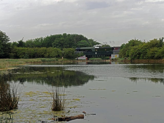 The Flying Scotsman coming over the Portsbridge at Hilsea lines / Foxes Forest