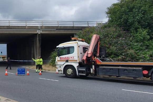 A car has crashed through a barrier on the M275 northbound and landed on the roundabout below near the city council's park and ride facility in Tipner on July 15 2020. Picture: Habibur Rahman