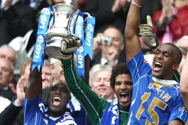 GLORY: Pompey captain Sol Campbell lifts the FA Cup in 2008