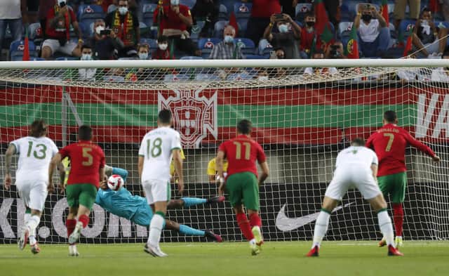 Gavin Bazunu saved a first-half penalty from Cristiano Ronaldo in tonight's World Cup qualification match. Picture: AP Photo/Armando Franca