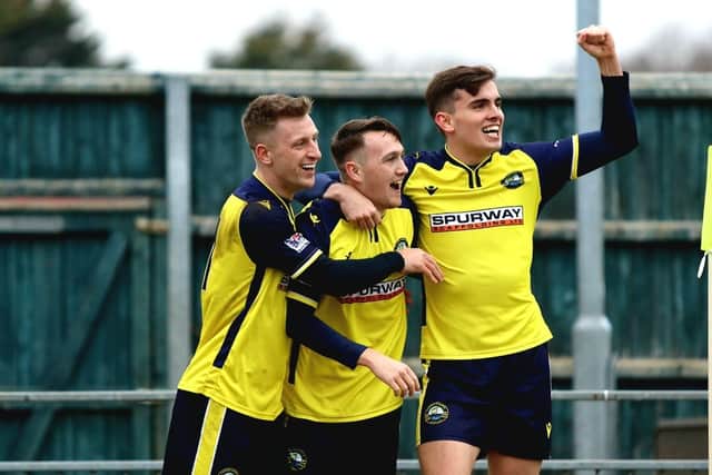 Harry Kavanagh, right, and Mason Walsh, left, join Ryan Pennery to celebrate his opener for Gosport Picture: Tom Phillips