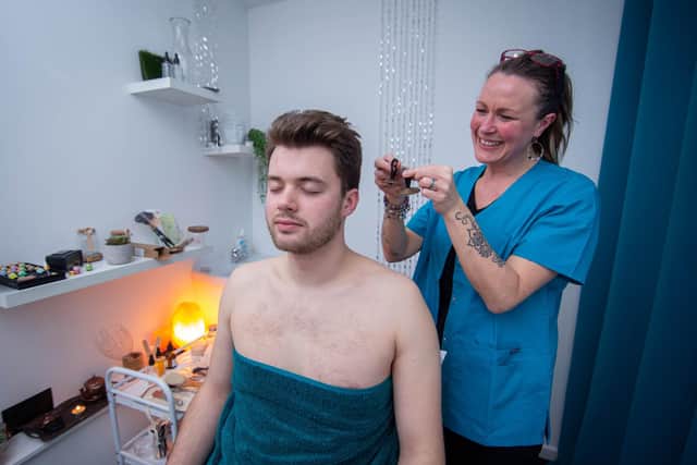 Pictured: News reporter Joe Buncle gets a hands on experience of the ASMR treatment with Kellie Ripley on Tuesday, February 21 2023.

Picture: Habibur Rahman