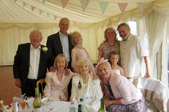 Doris Curry will be turning 105 on June 11, 2020, and has just recovered from Covid-19. Pictured: Doris surrounded by her family