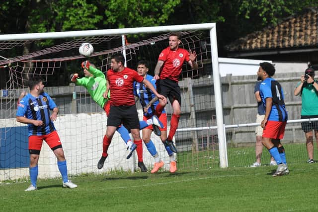 Locks Heath (red) in action during their Hampshire League Cup final loss to Sway last month. Picture by Ian Grainger.