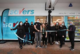 Manager Reece Webber cuts the ribbon, backed by the staff. Opening of Savers, High St, GosportPicture: Chris Moorhouse (jpns 180621-01)