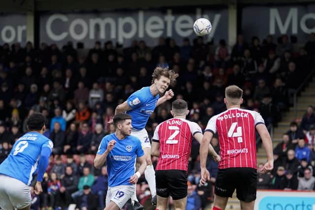Pompey skipper Sean Raggett powers a header against Cheltenham in Saturday's 1-0 defeat. Picture: Jason Brown/ProSportsImages