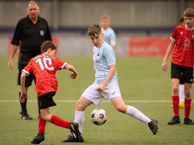 Action from the Portsmouth Youth League Geldard Invitation Cup final between Jubilee 77 U13s and Castle United U13s (light blue and white kit). Picture: Keith Woodland (190321-822)