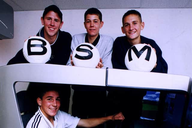 Lewis Buxton (in the driving seat) poses with fellow scholars Lee Molyneaux, Anthony Pulis and Shaun Cooper at BSM's driver training centre in London Road, Portsmouth