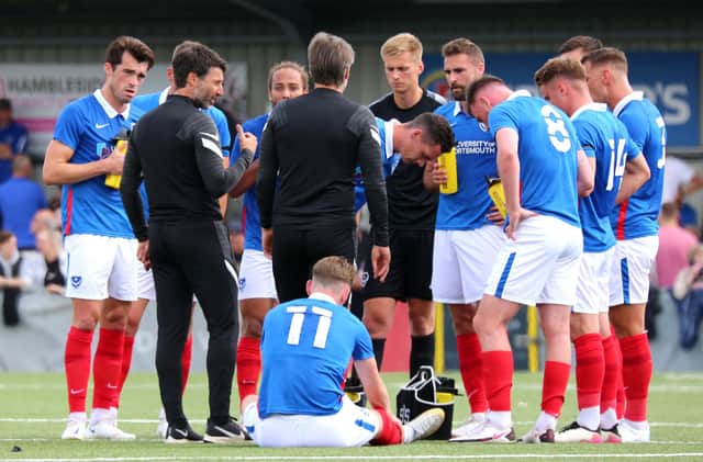 Danny Cowley addresses his Pompey team at half-time of their friendly against the Hawks. It has been a contracted squad propped up by triallists this summer. Picture: Paul Collins