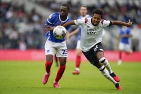 Abu Kamara puts Derby's Korey Smith under pressure in the Pride Park clash. Picture: Jason Brown/ProSportsImages