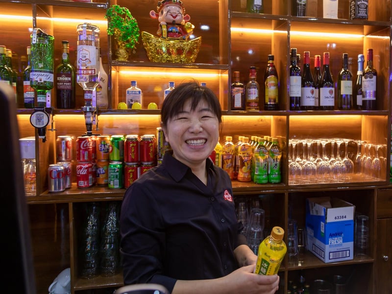 Owner Vicky Sun (40) behind the bar at the Mayfair Chinese Retaurant in Guildhall Square. Picture: Mike Cooter (081224)