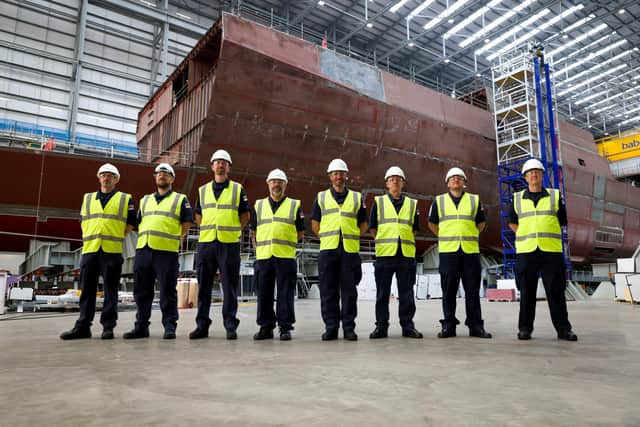 The future Type 31 Frigate HMS Venturer, which is currently in build at Rosyth dockyard in Scotland and the first members of her ships company. Comprised of Commander Chris Cozens RN, (Senior Naval Officer) WO1 Neil Freeman RN, (Deputy Marine Engineering Officer) WO1 Pete Johnson RN, (Executive Warrant Officer) Chief Petty Officer (CPO) Samuel Carr, (CPO Above Water Weapons) CPO Jon Donovan, (CPO Supply Chain) CPO Graeme Coventry, (CPO Marine Engineer – M3 Group Head) Petty Officer Andrew Conway, (PO Communication Information Systems) and Leading Writer Andrew Fleming.