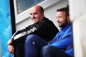 Former Pompey boss Paul Cook sitting alongside Noel Hunt on the Blues bench at Notts County in 2017