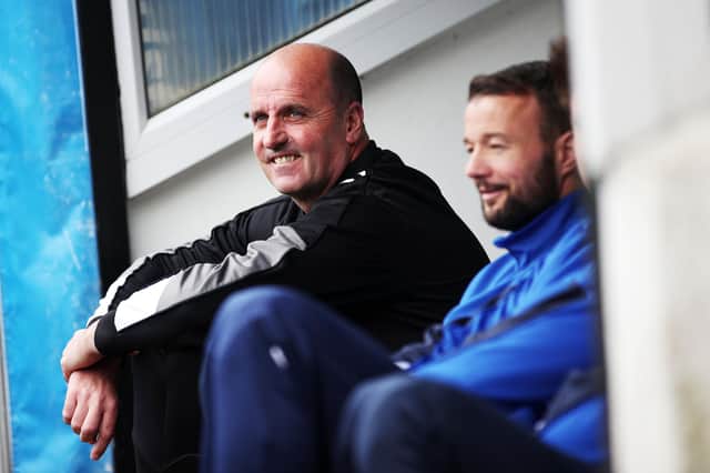 Former Pompey boss Paul Cook sitting alongside Noel Hunt on the Blues bench at Notts County in 2017