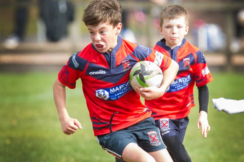 Langholm's Jack Hughes on the ball at the Jedburgh mini-rugby event
