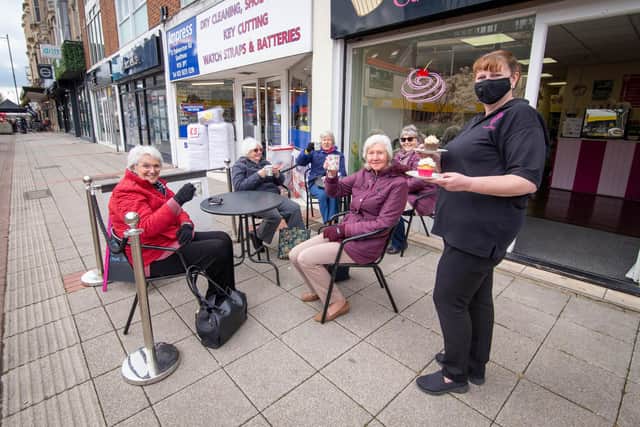 The Big reopeningPictured: Members Southsea Morning WI having hot chocolate with owner Alison Barnes outside Sweet Cakes, Palmerston road, Southsea on 12 April 2021Picture: Habibur Rahman