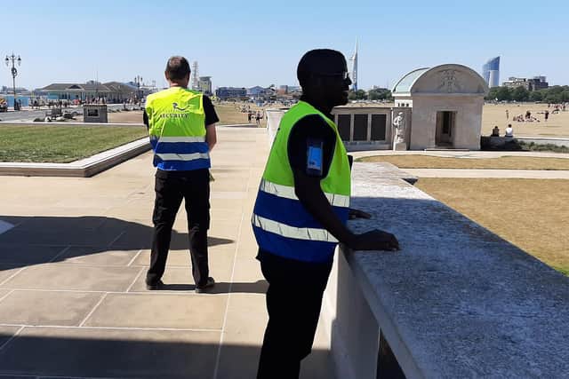 Guards from Southsea-based Vespasian Security pictured protecting Portsmouth's Naval Memorial on Southsea Common after vile yobs used it as a toilet.