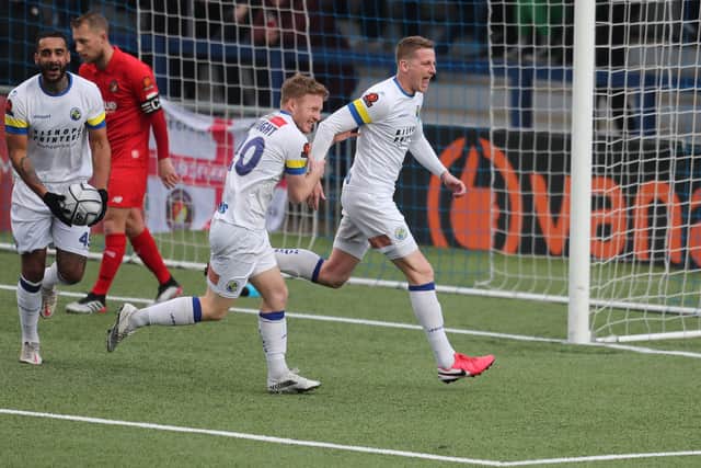 Joe Oastler, right, has just scored Hawks' fourth goal. Picture by Dave Haines.