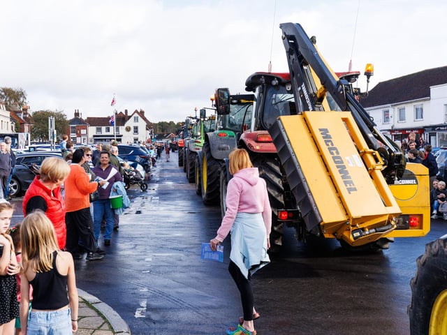 Crowds gathered in Wickham Square to watch the procession of tractors go by all to raise money for Rowans Hospice and Guide Dogs.