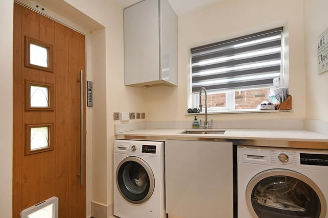 Off the kitchen is a laundry room with cupboards and work-top in the same finish as the kitchen, with sink and drainer and space for both a washing machine and a dryer. There is also an additional ground floor w/c and a rear door with access to the rear garden.