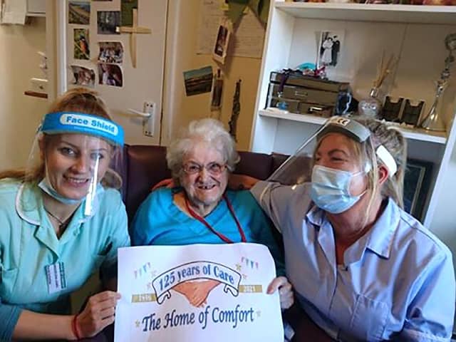 Home of Comfort staff member Magdalena Jones, resident Eileen Fryer, and staff member Sandra Hinks.
Credit: Home of Comfort