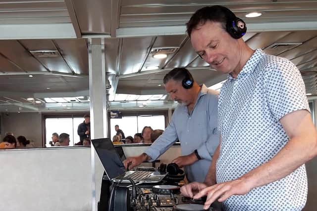 DJ Crabbie and DJ Stu Murray from Hush perform onboard a Wightlink ferry during the 2019 Isle of Wight Festival. 