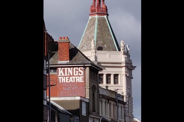 An old painted sign for the Kings Theatre, which, of course, still exists.