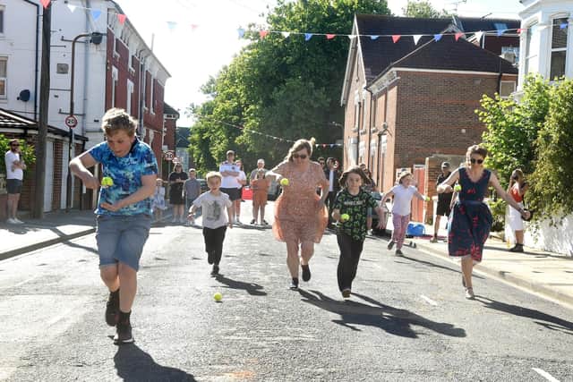 Residents in Herbert Road, Southsea, celebrated The Queen's Platinum Jubilee with a street party on Thursday, June 2, 2022. Pictured is: The egg and spoon race. Picture: Sarah Standing (020622-8818).