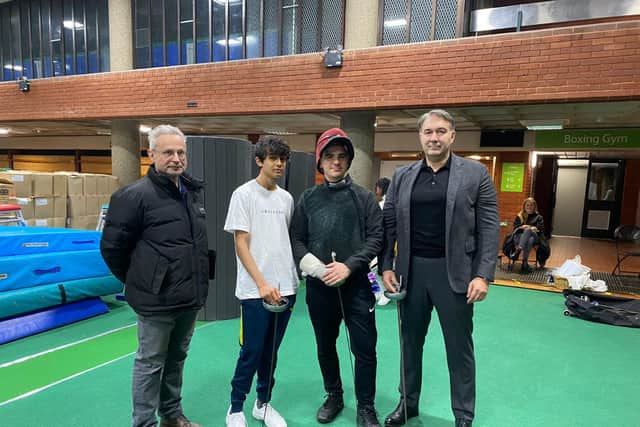 Chris Tidmarsh and Dmitry Leus with young fencers at Brixton Fencing Club