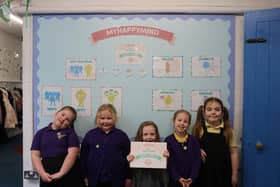 Children from Penbridge Infant School celebrate recieving this award.