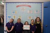Children from Penbridge Infant School celebrate recieving this award.
