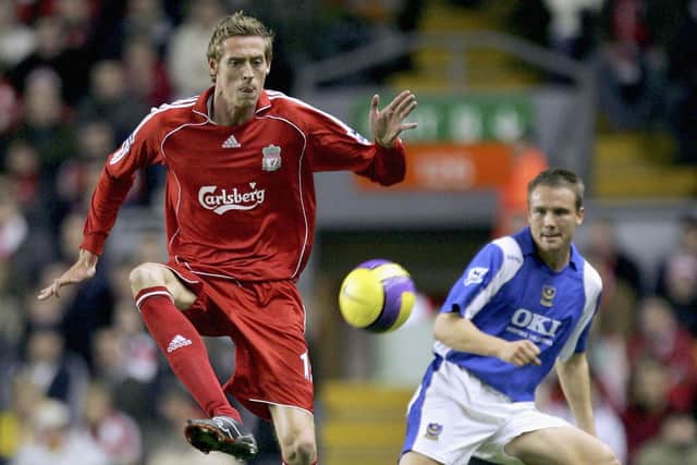 Peter Crouch in action for Liverpool against Pompey in 2006 at a time when the Reds had Carlsberg as their shirt sponsors. Currently no Premier League clubs have a drinks brand on the front of their shirts - but half have a gambling company instead. Photo by Laurence Griffiths/Getty Images.