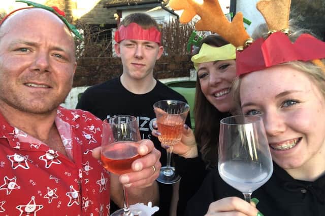 Dad-of-two Simon Cooper was visiting his sister-in-law in Gosport when a freak accident meant he was left paralysed from the neck down, and his family launched a fundraiser for adaptations to his home. Pictured: Simon, his son Lee, wife Leanne and daughter Abbie