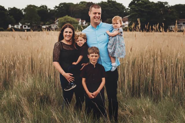 Max Ferrand, three, pictured in his mum Leanne Ferrand's arms with his dad Brett Ferrand, brother Toby and sister Phoebe. Picture: Cherry Blossom Photography