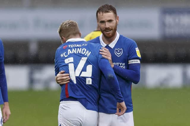 Andy Cannon celebrates Pompey's win at Burton with Tom Naylor. Picture: Daniel Chesterton/phcimages.com
