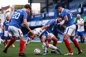 King's Lynn's Adam Marriott can find no way through Pompey - and it was a familiar fate for his team-mates in a 6-1 defeat at Fratton Park. Picture: Kieran Cleeves